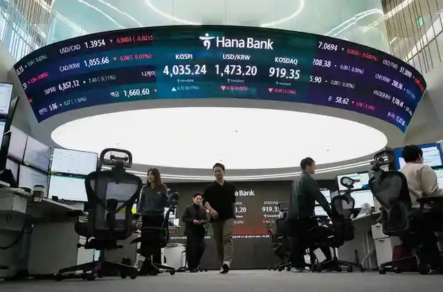 Asian shares are mixed after Wall Street inches closer to its all-time high