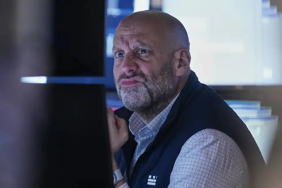 Stocks wind up mixed on Wall Street after spending most of the day in the red