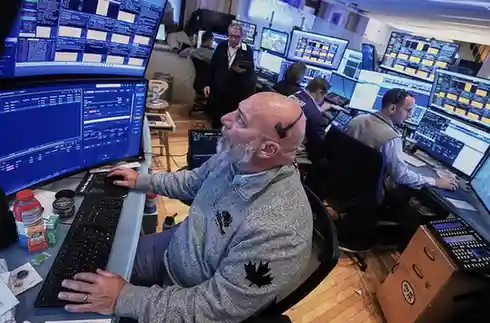 Big swings keep rocking Wall Street as US stocks drop sharply after erasing a morning surge